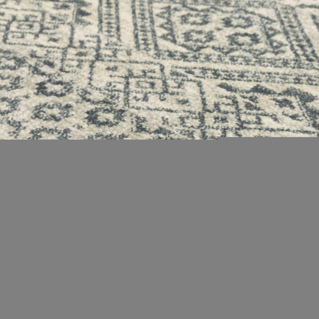 5' X 7' Blue And Beige Geometric Power Loom Stain Resistant Area Rug