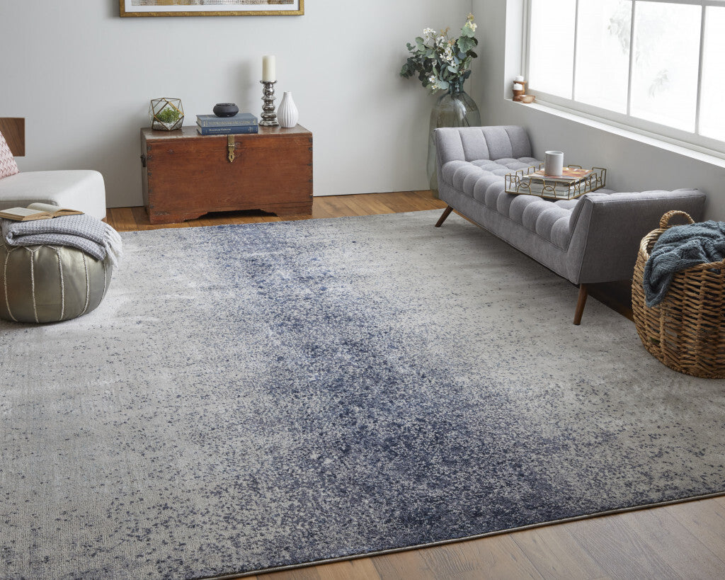 5' X 8' Ivory and Blue Abstract Power Loom Non Skid Area Rug